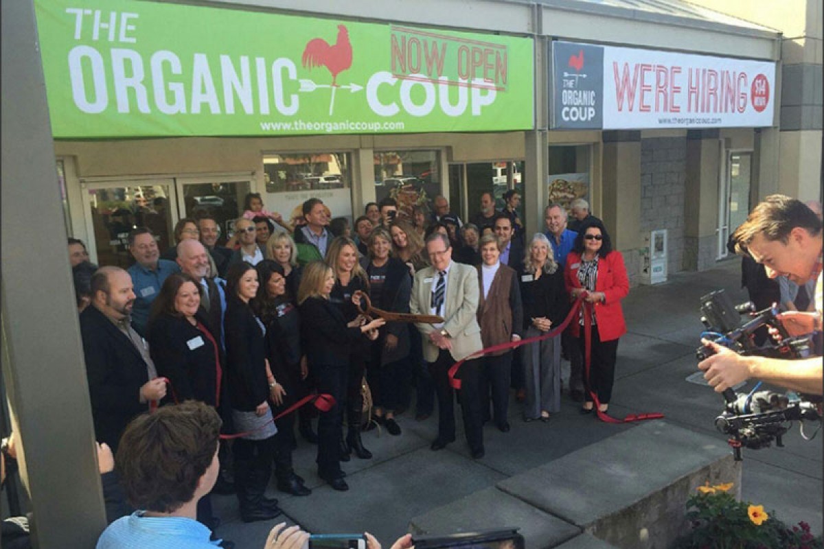 The Organic Coup team outside of a new location