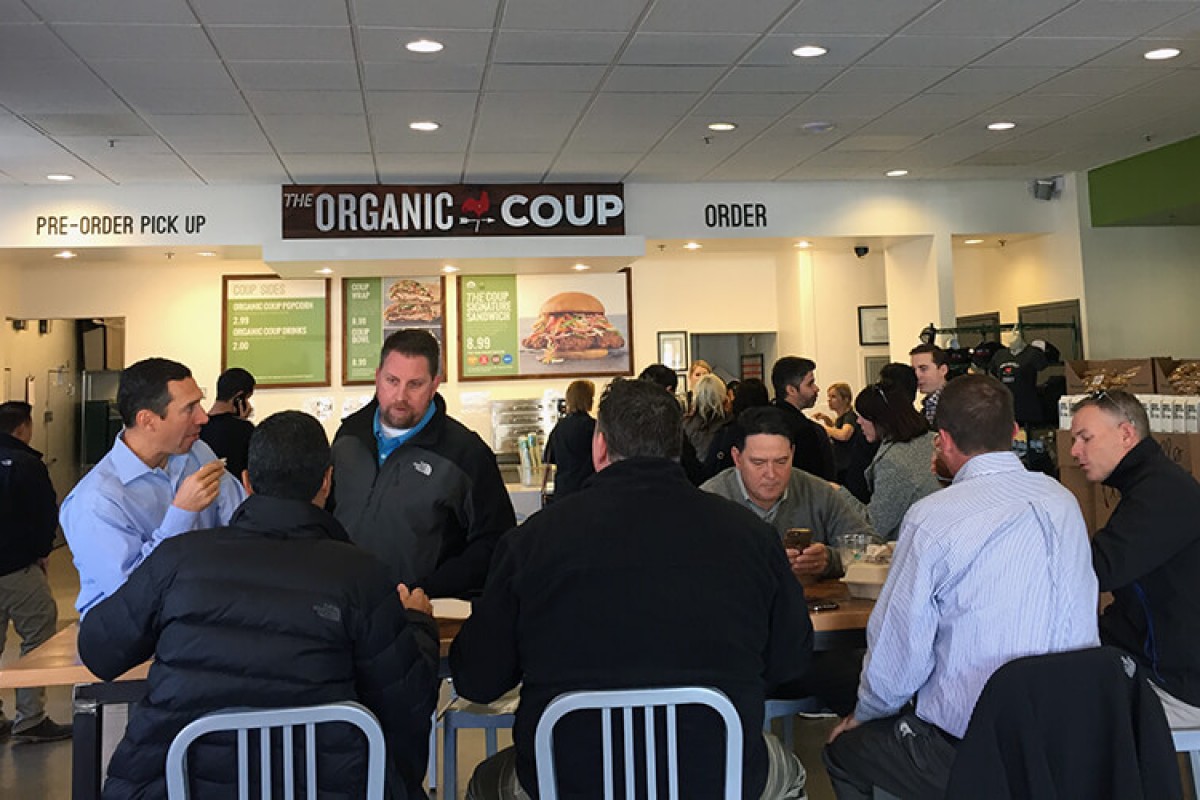 People eating lunch at an Organic Coup location