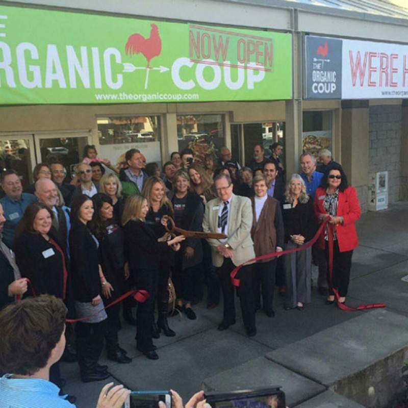 The Organic Coup team outside of a new location