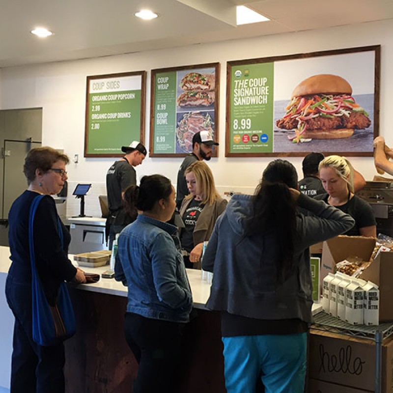 People ordering food at The Organic Coup