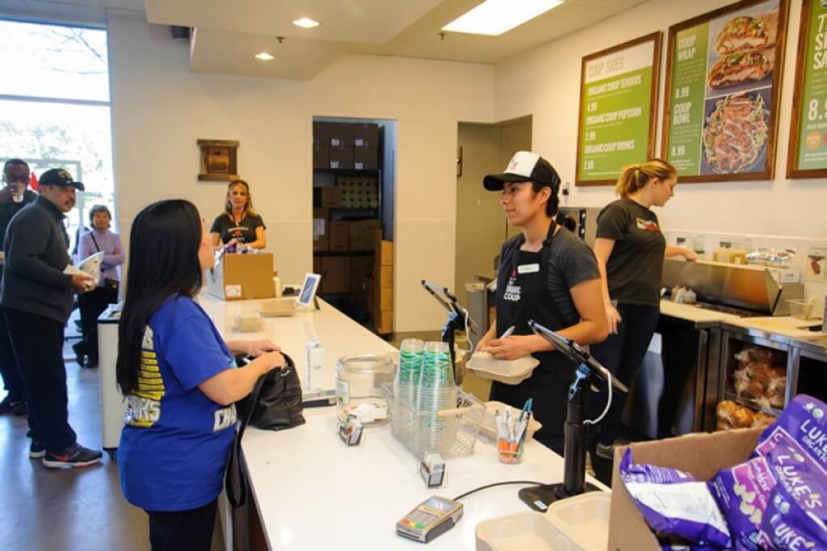 Customers ordering at The Organic Coup